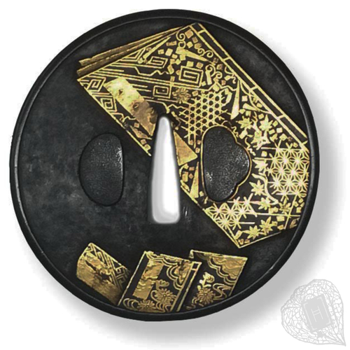 Untitled tsuba An Awa Shōami sword guard patterned with books